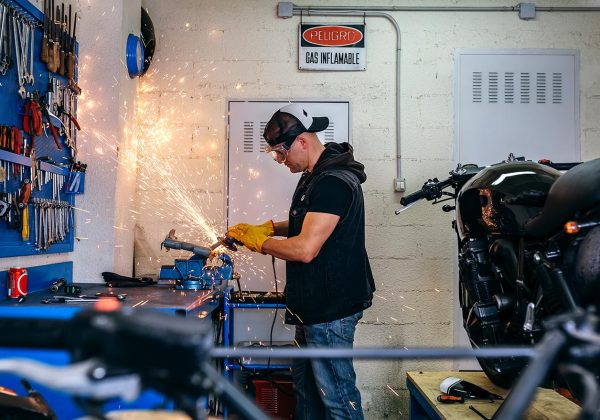 motorcycle-mechanic-using-a-grinder-B3JSF5V-resize.jpg